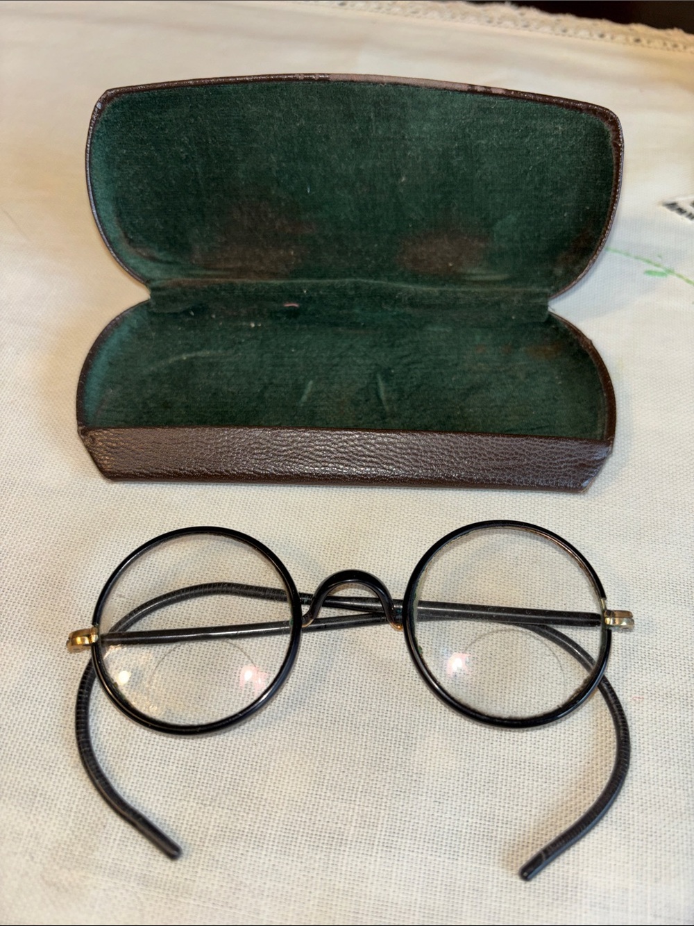 VINTAGE round wire-rim or Windsor-style eyeglasses with cable temples resting in